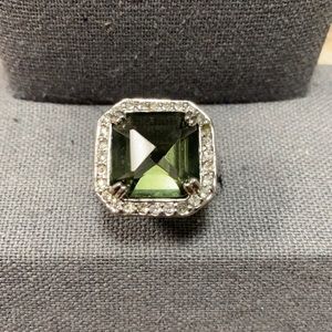 Smoky brown center stone with clear crystals. band size 7